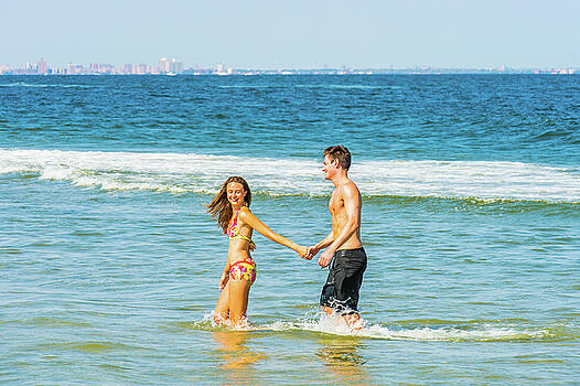 Alexander Image - Young American Couple traveling, relaxing on the beach in New Je Alexander Image - Young American Couple traveling, relaxing on the beach in New Je