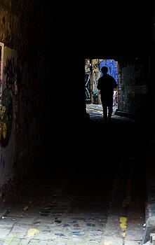 Jacek Wojnarowski - Silhouette Man Walking in Dark Alley Jacek Wojnarowski - Silhouette Man Walking in Dark Alley