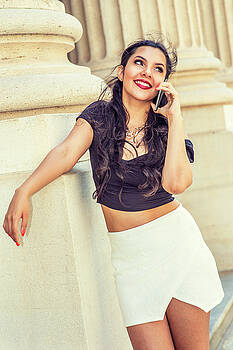 Alexander Image - Young American female college student talking on cell phone outs Alexander Image - Young American female college student talking on cell phone outs