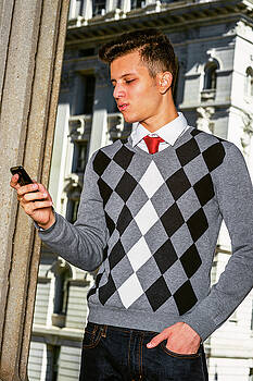 Alexander Image - Young American Man texting outside in New York Alexander Image - Young American Man texting outside in New York