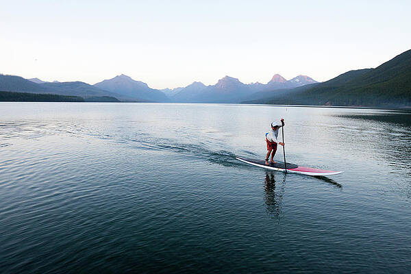 Wall Art - Photograph - A Man Stand Up Paddle Boards Sup #1 by Craig Moore
