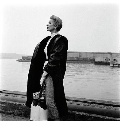 Wall Art - Photograph - A Model Standing On A Dock In A Leather Coat #1 by Richard Rutledge