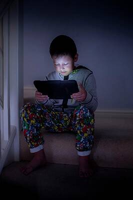 Wall Art - Photograph - Boy Using A Digital Tablet In The Dark #1 by Science Photo Library