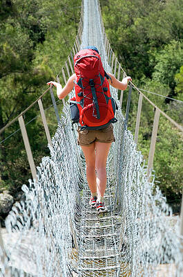 Wall Art - Photograph - Hiker Crossing The Bowtell Swing Bridge #1 by Lars Schneider