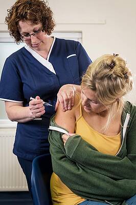 Wall Art - Photograph - Nurse With Patient Discussing Hpv #1 by Science Photo Library