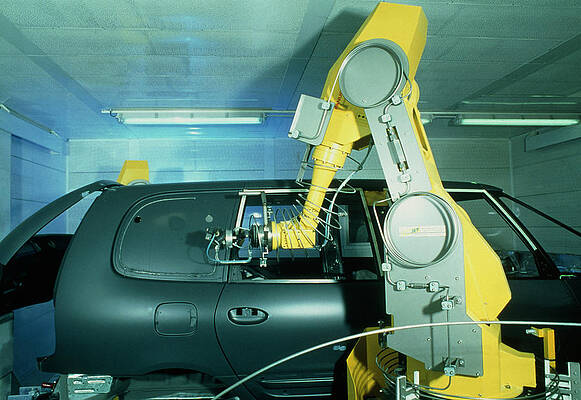 Wall Art - Photograph - Robot Arm Using Waterjet Cutter For Car Production #1 by Science Photo Library