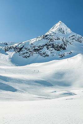 ski tourer on big mountains in a winterlandscape by Leander Nardin ski tourer on big mountains in a winterlandscape by Leander Nardin