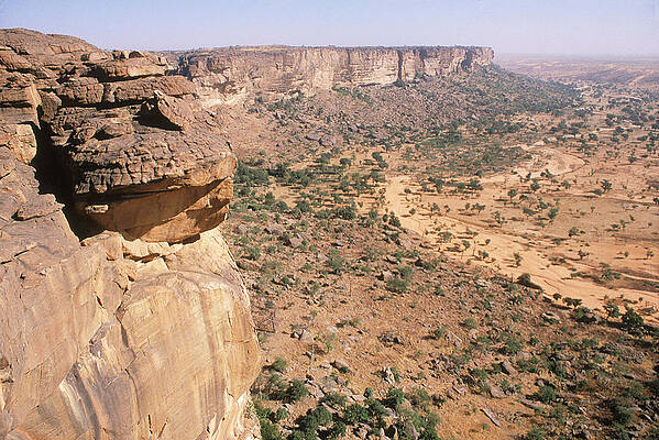 Wall Art - Photograph - The Bandiagara Cliffs Loom #1 by Jose Azel