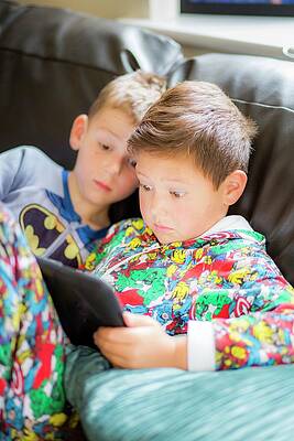 Wall Art - Photograph - Two Boys Using A Digital Tablet #1 by Science Photo Library
