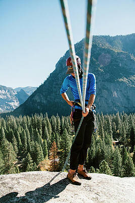 Wall Art - Photograph - A Climber At The Top Of Pitch 3 On Swan #2 by Ryan Tuttle
