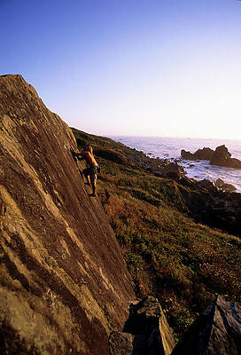 Wall Art - Photograph - A Man Is Bouldering Near The Ocean #2 by Bennett Barthelemy