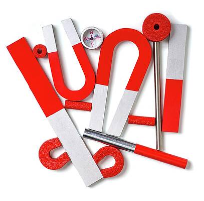 Wall Art - Photograph - Magnets With A Small Compass #2 by Science Photo Library