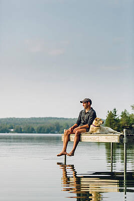 Wall Art - Photograph - Man And Dog Sitting On The Dock #2 by Corey Hendrickson