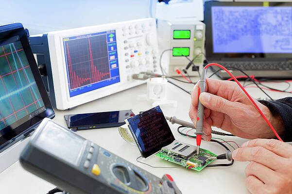Wall Art - Photograph - Person Working In An Electronics Lab #2 by Science Photo Library