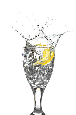 Wall Art - Photograph - Slice of lemon in Glass #2 by Peter Lakomy