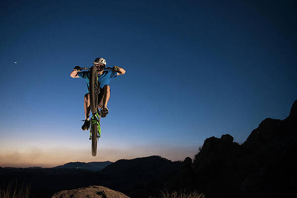 Wall Art - Photograph - A Man Performs Trial Bike Standing #3 by Marcos Ferro