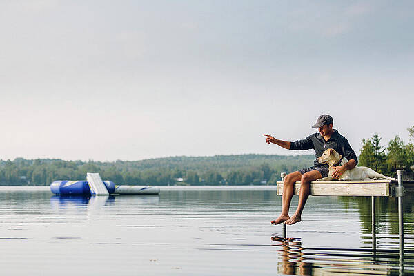 Wall Art - Photograph - Man And Dog Sitting On The Dock #3 by Corey Hendrickson