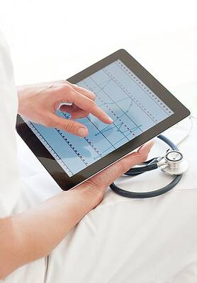 Wall Art - Photograph - Nurse Using A Tablet Computer #3 by Science Photo Library