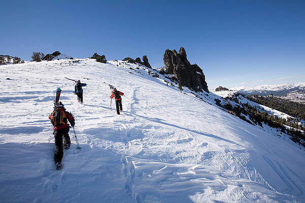 Wall Art - Photograph - Three Skiers Hike To The Top Of A Hill #3 by Jose Azel