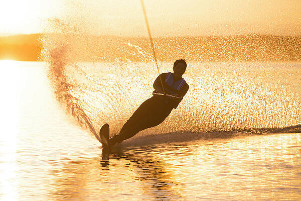 Wall Art - Photograph - A Woman Water Skis On Whitefish Lake #4 by Craig Moore
