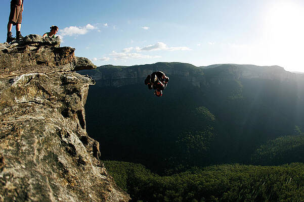 Wall Art - Photograph - A Base Jumper Performs A Front Flip by Krystle Wright