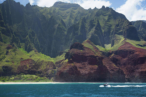 A Catamaran Cruises Along The Napali Print by Matthew Micah Wright