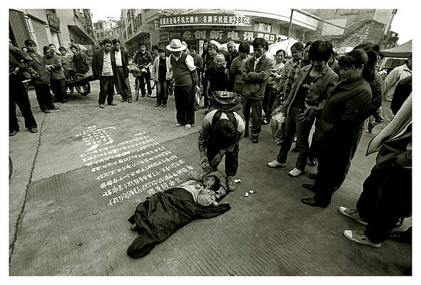 Wall Art - Photograph - A Child Is Placed In The Middle by Simon O'Dwyer