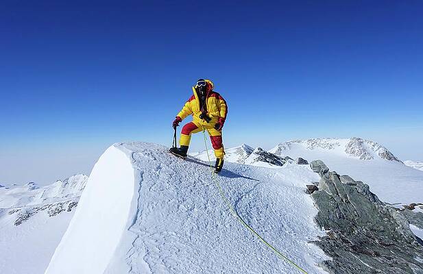 Wall Art - Photograph - A Climber On The Summit Of Mt Vinson by Science Photo Library