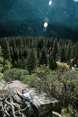 Wall Art - Photograph - A Climber Resting At The Base Of Pitch by Ryan Tuttle