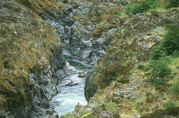 Wall Art - Photograph - A Group Of Rafters Float Through Mule by Jeff Diener