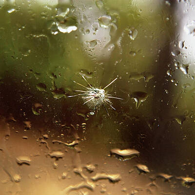 Wall Art - Photograph - A Hole In Cracked Glass by Ron Koeberer