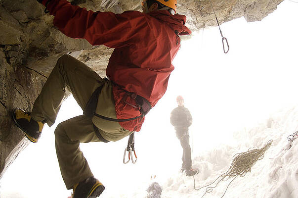 Wall Art - Photograph - A Man Is Belayed While Rock Climbing by Heath Korvola