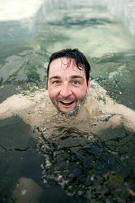 Wall Art - Photograph - A Man Plunges Into A Pool In The Frozen by Olivier Renck