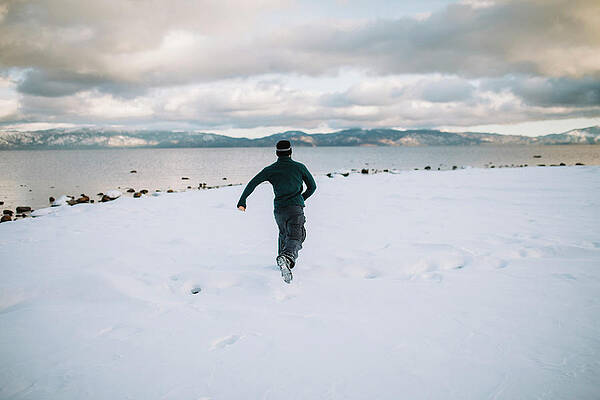 Wall Art - Photograph - A Man Running In Lake Tahoe by Ryan Tuttle