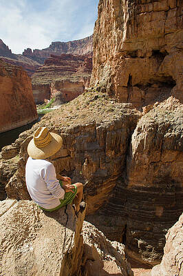 Wall Art - Photograph - A Man Sits High On The Rim Of South by Doug Marshall