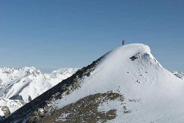 Wall Art - Photograph - A Man Stands Atop A High Ridge Line by Kennan Harvey