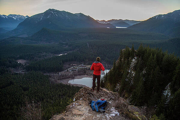 Wall Art - Photograph - A Man Stands On The Edge Of A Rock by Michael Hanson
