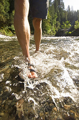 Wall Art - Photograph - A Man Walking Through A Shallow Spot by Lars Schneider