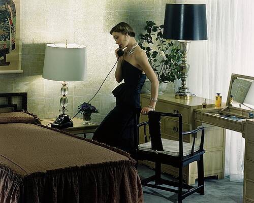 Wall Art - Photograph - A Model Wearing An Evening Gown On The Telephone by Herbert Matter