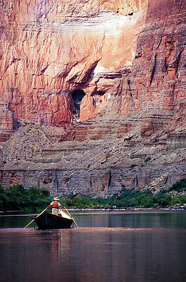 Wall Art - Photograph - A River Guide Rowing A Wooden Dory by Kyle George