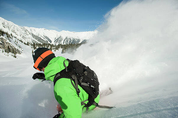 Wall Art - Photograph - A Skier Throws Up A Large Cloud Of Snow by Doug Marshall