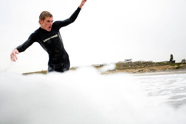 Wall Art - Photograph - A Surfer Enjoys The Waves In Carlsbad by Jay Reilly