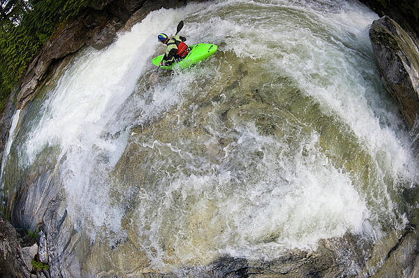 Wall Art - Photograph - A Whitewater Kayaker Slides by Doug Marshall
