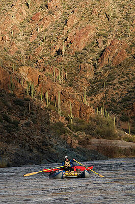 Wall Art - Photograph - A Whitewater Rafters Rows His Boat by Kyle George