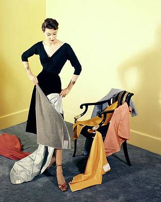 Wall Art - Photograph - A Woman With Assorted Pieces Of Fabric by Herbert Matter