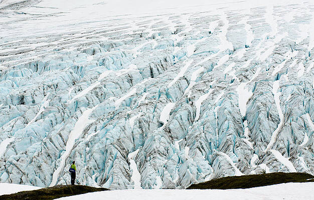 Wall Art - Photograph - A Young Man Stands In Wonder In Front by Keri Oberly