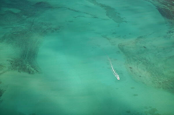 Aerial Of Turquoise Waters With Passing Print by Merten Snijders