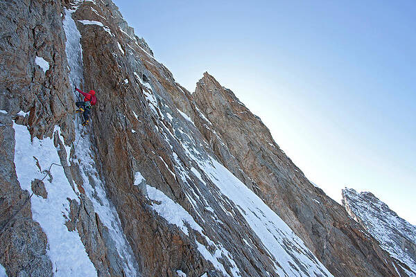 Wall Art - Photograph - Alpinist Climbing Thin Ice On The Last by Jonathan Griffith