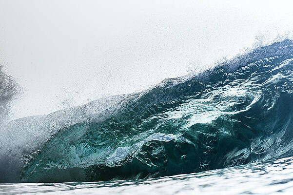 Wall Art - Photograph - An Empty Wave Breaks Over A Shallow Reef by Sergio Villalba