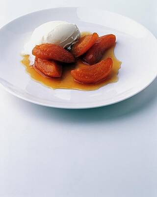 Wall Art - Photograph - Apricots Served With Vanilla Ice Cream by Romulo Yanes